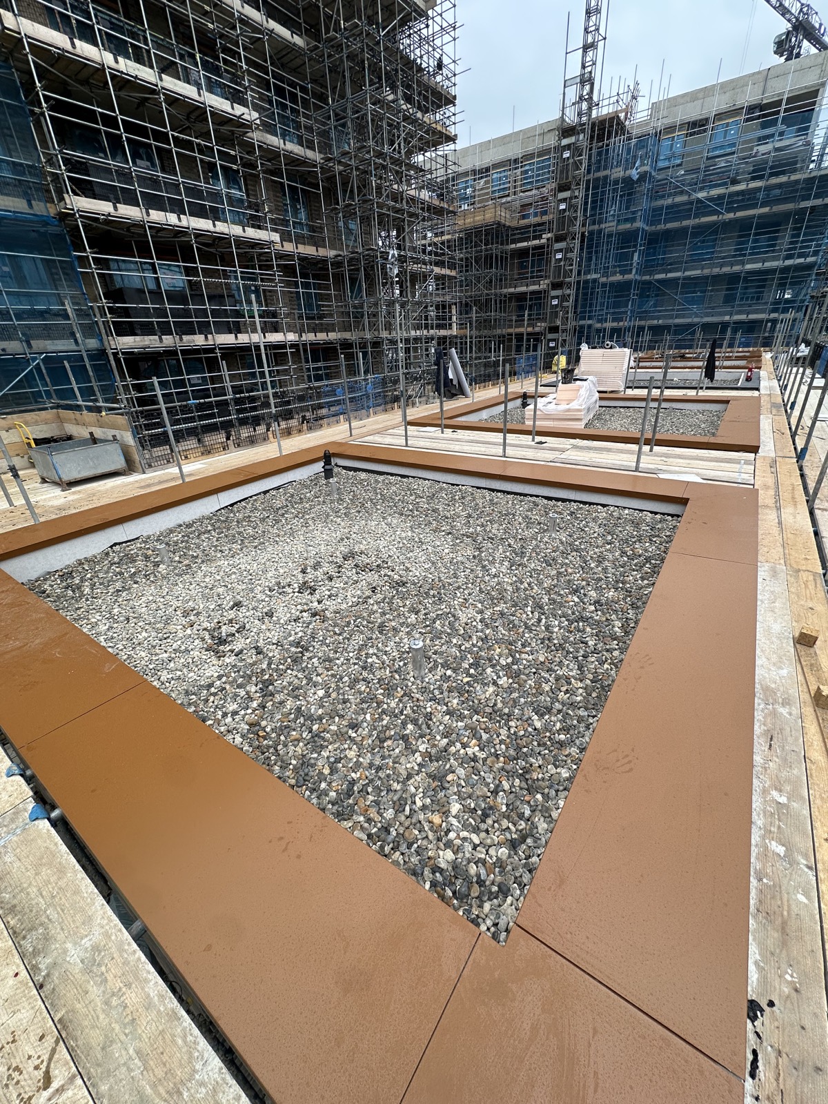 Stone ballast being placed over the completed roof build-up.