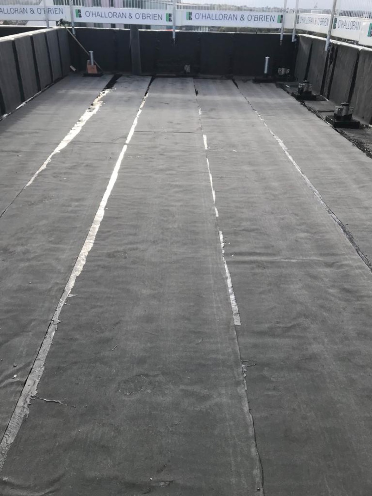 Installed membrane across a separate flat roof area.